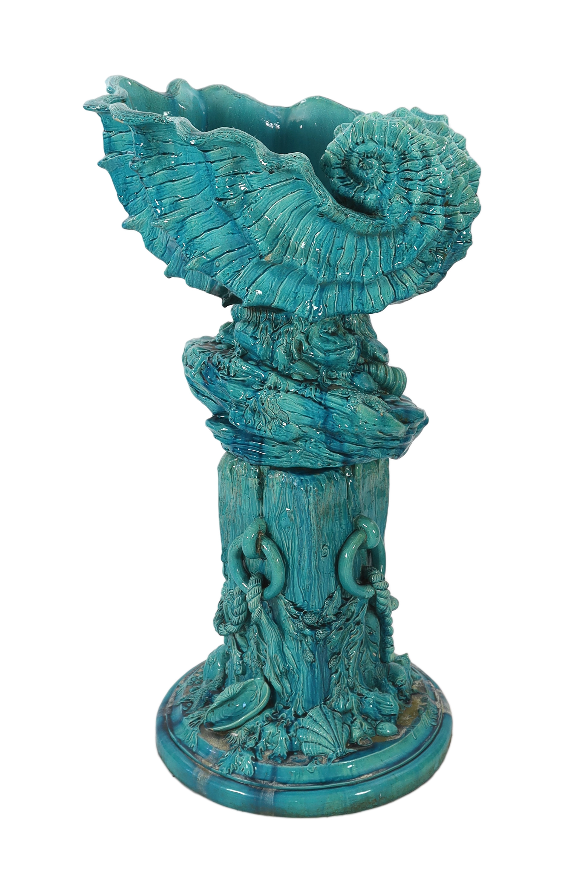 An impressive Burmantofts turquoise glazed faience ‘giant shell’ jardiniere and stand, c.1900, small glaze losses and some weathering